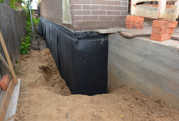 SJ Waterproofing Pros technician performing targeted Interior Drainage System assessment in Brandon, WI